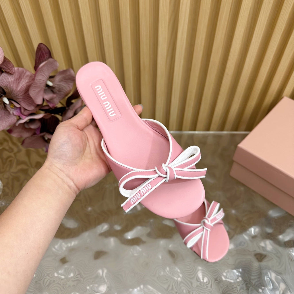 SLIDES SANDALS IN PINK CALFSKIN WITH BOW IN TRAP