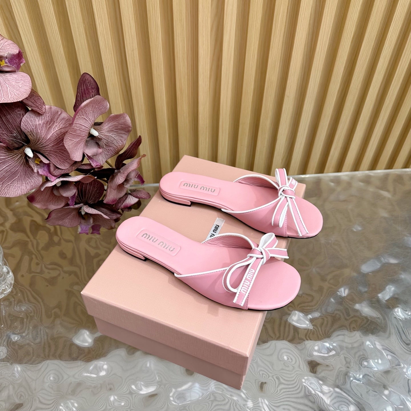 SLIDES SANDALS IN PINK CALFSKIN WITH BOW IN TRAP