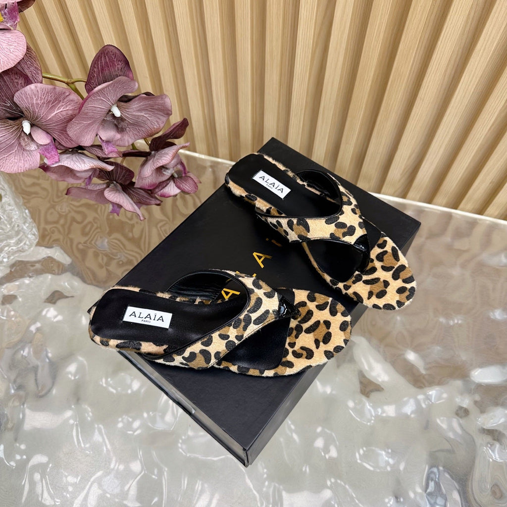 ALAIA PLATFORM THONG SANDALS 25S IN LEOPARD PONY HAIR LEATHER