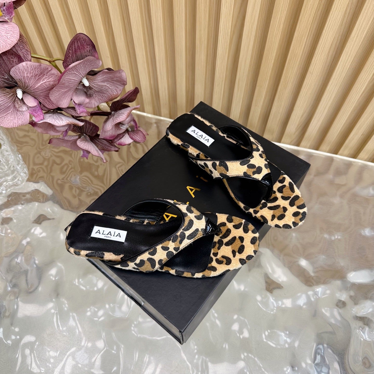 ALAIA PLATFORM THONG SANDALS 25S IN LEOPARD PONY HAIR LEATHER