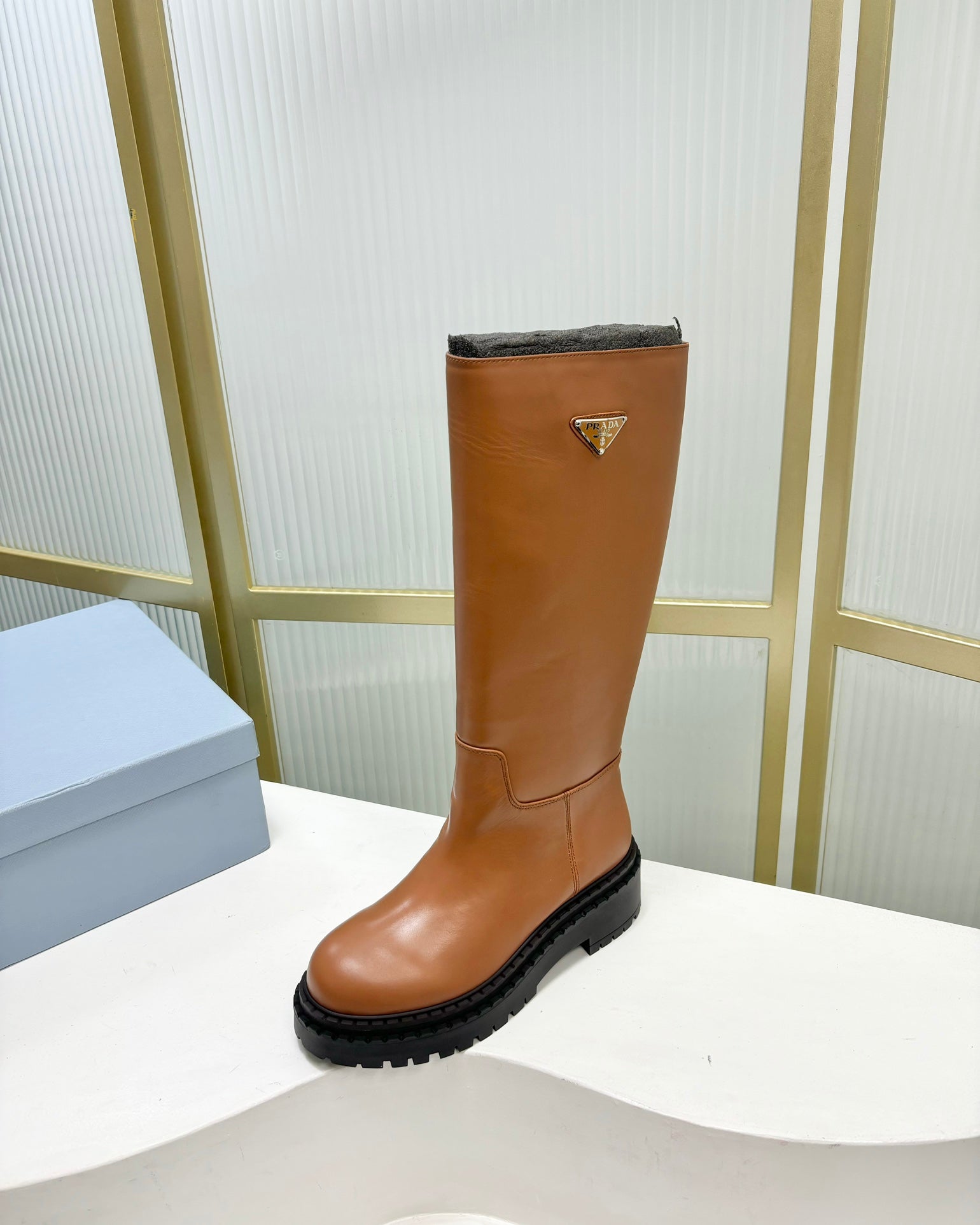 KNEE BOOTS WITH TRIANGLE LOGO IN CAMEL CALFSKIN