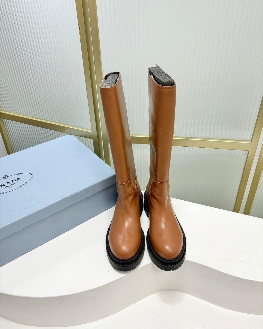 KNEE BOOTS WITH TRIANGLE LOGO IN CAMEL CALFSKIN