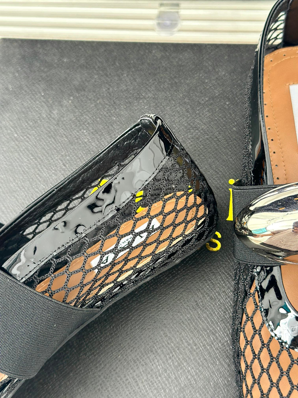 ALAIA MARY JANE SHOES IN BLACK MESH WITH SILVER HARDWARE