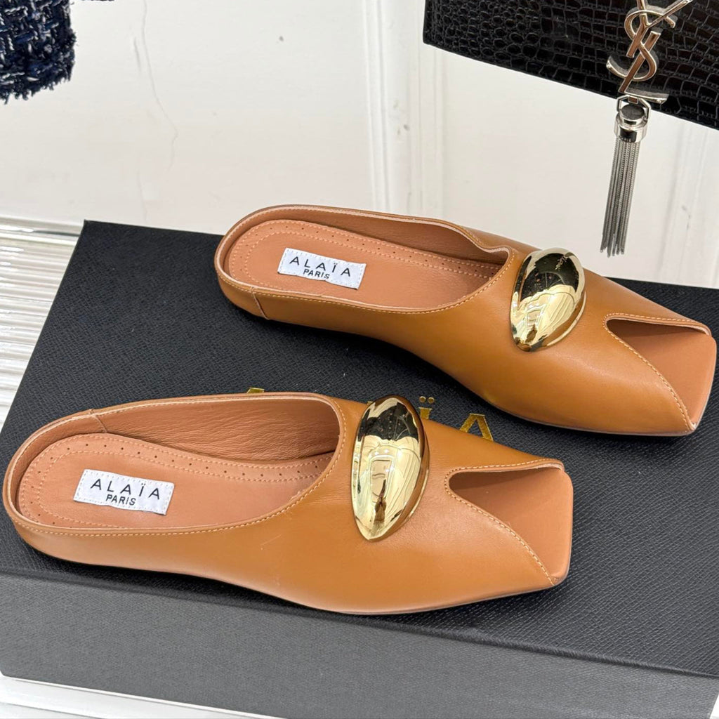 ALAIA FLAT MULE IN BRONZE BROWN LAMBSKIN WITH GOLD HARDWARE