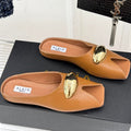 ALAIA FLAT MULE IN BRONZE BROWN LAMBSKIN WITH GOLD HARDWARE