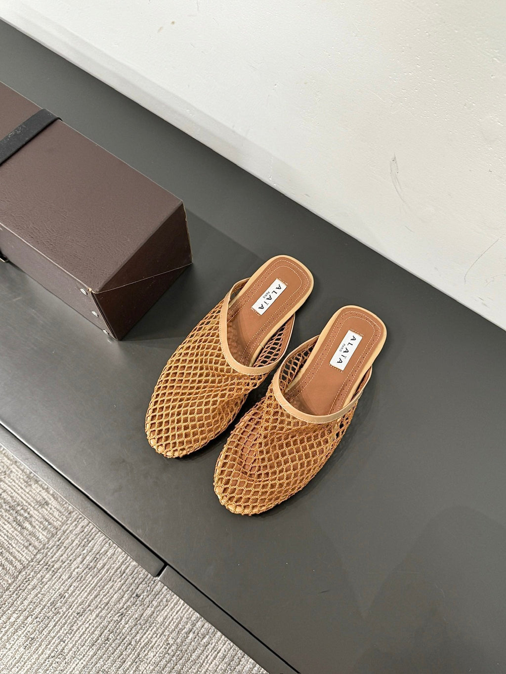 ALAIA FLAT MULES IN COPPER BROWN MESH FISHNET
