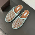 ALAIA FLAT MULES IN LIGHT BLUE MESH FISHNET