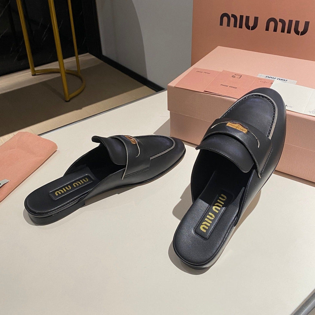 MULES SLIPPERS BLACK COWHIDE WITH GOLD COIN