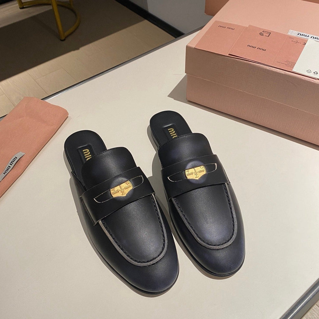 MULES SLIPPERS BLACK COWHIDE WITH GOLD COIN