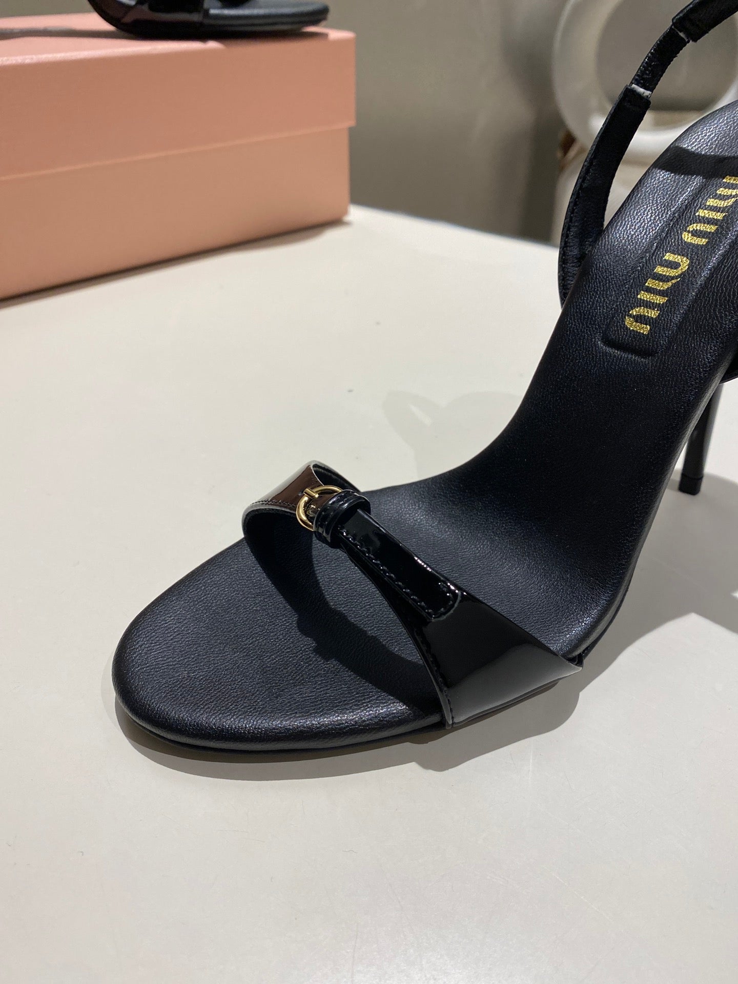 TWO STRAP HIGH HEELED SANDALS IN BLACK GLOSSY SHEEPSKIN