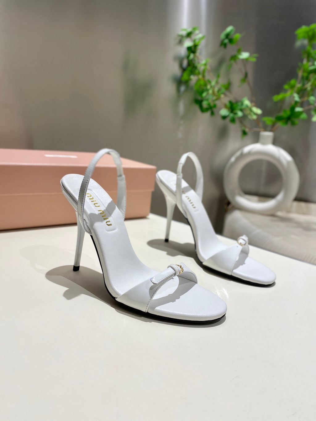 TWO STRAP HIGH HEELED SANDALS IN WHITE GLOSSY SHEEPSKIN