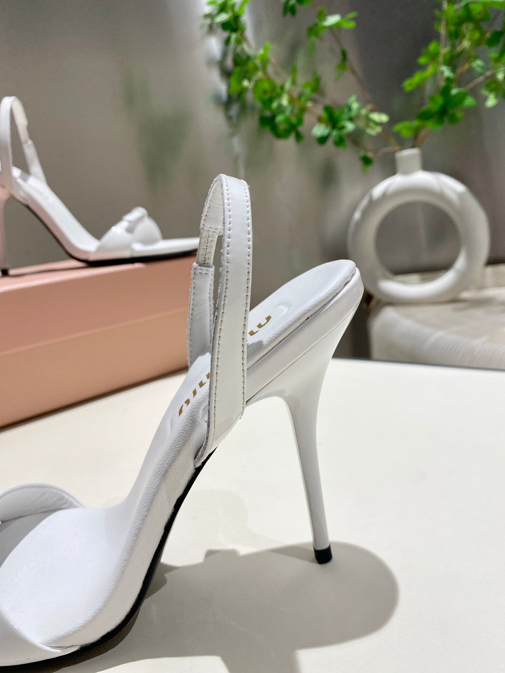 TWO STRAP HIGH HEELED SANDALS IN WHITE GLOSSY SHEEPSKIN