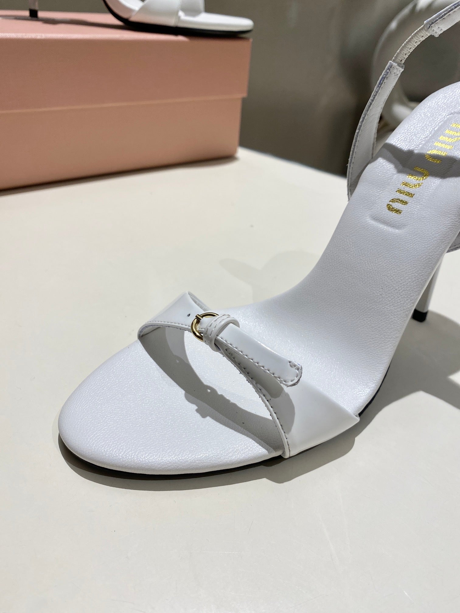 TWO STRAP HIGH HEELED SANDALS IN WHITE GLOSSY SHEEPSKIN
