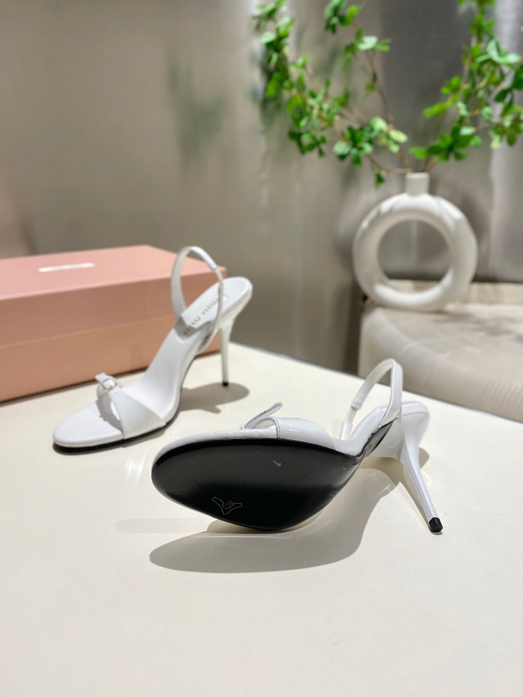 TWO STRAP HIGH HEELED SANDALS IN WHITE GLOSSY SHEEPSKIN