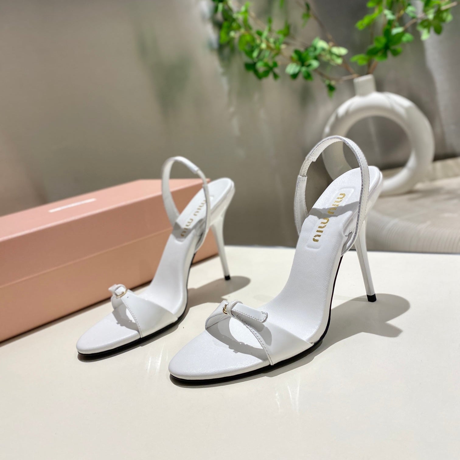 TWO STRAP HIGH HEELED SANDALS IN WHITE GLOSSY SHEEPSKIN