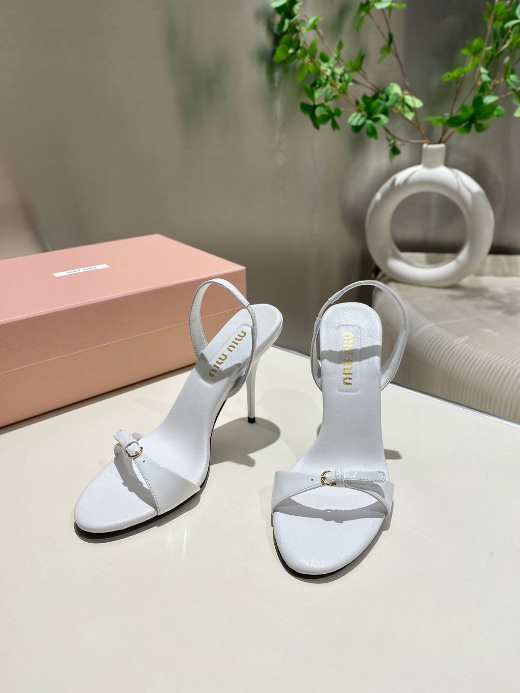 TWO STRAP HIGH HEELED SANDALS IN WHITE GLOSSY SHEEPSKIN