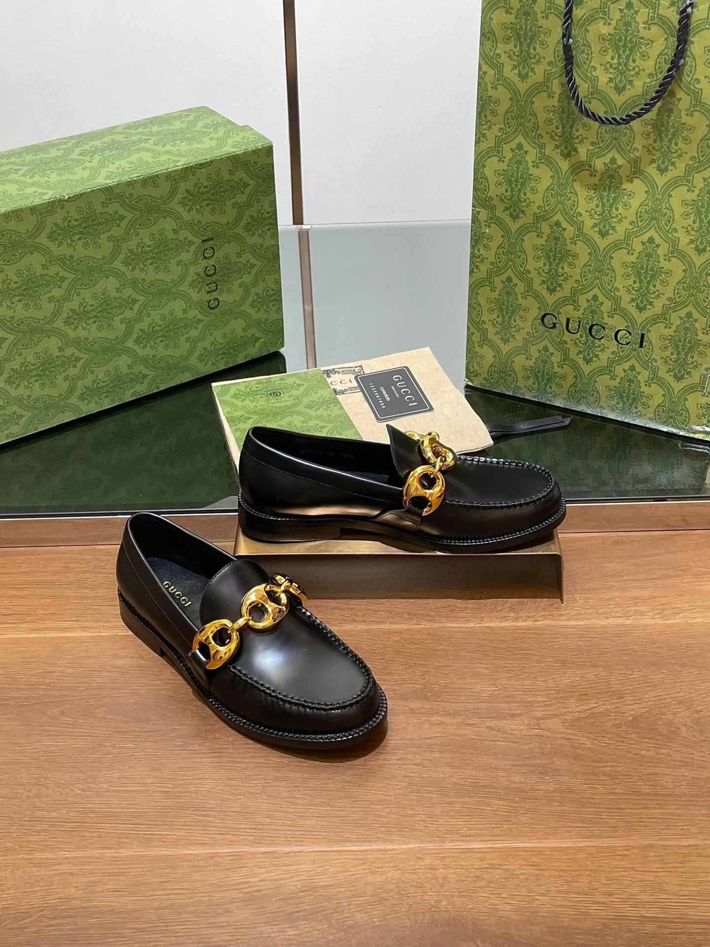GG LOAFER SHOES IN BLACK CALFSKIN WITH GOLD HARDWARE
