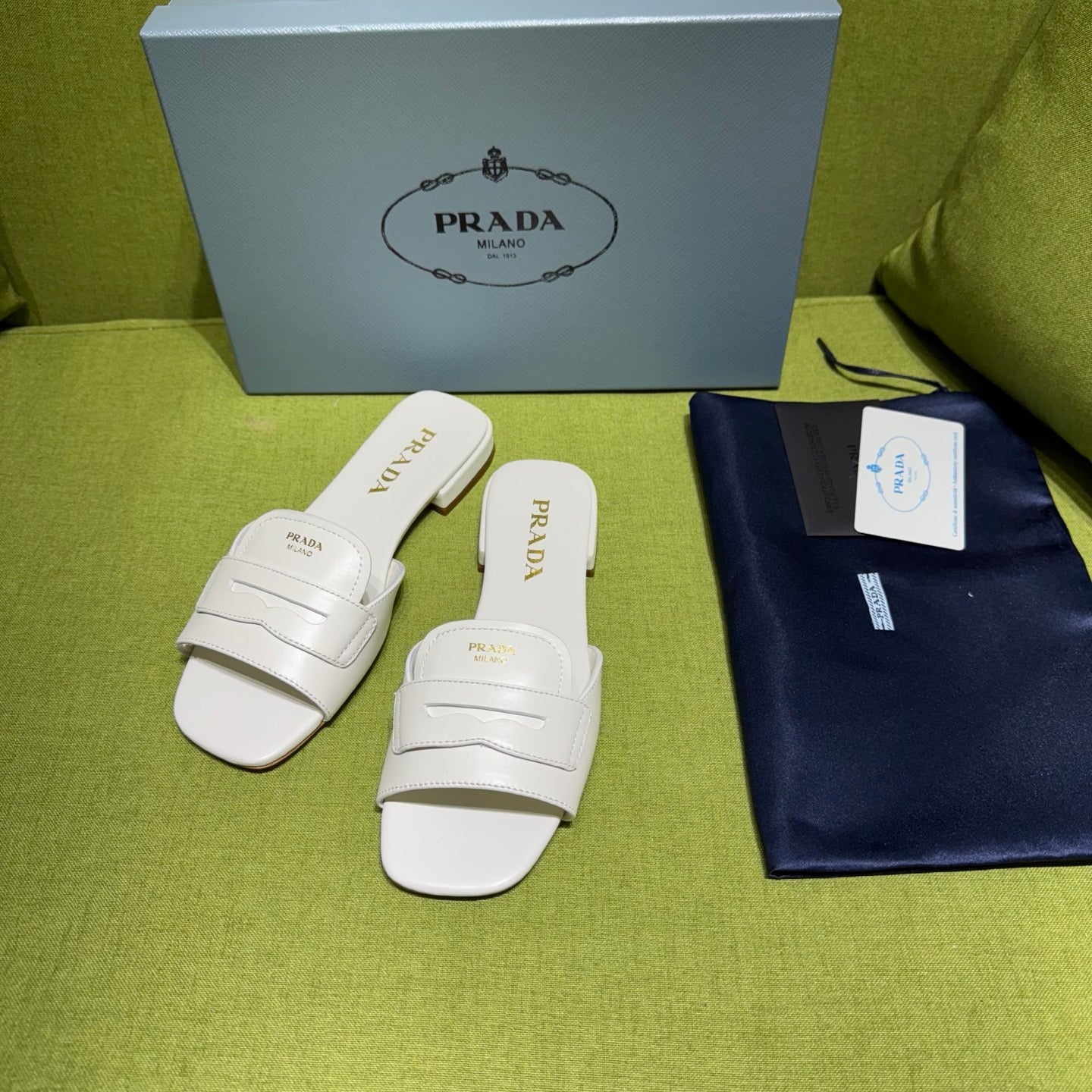 PRADA 25S SLIDES IN WHITE CALFSKIN
