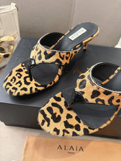 ALAIA HEELED THONG 25S 55 MM IN LEOPARD PONY HAIR LEATHER
