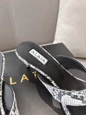 ALAIA HEELED THONG SANDALS 25S 55MM IN WHITE AND BLACK LAMBSKIN SNAKE-EMBOSSED