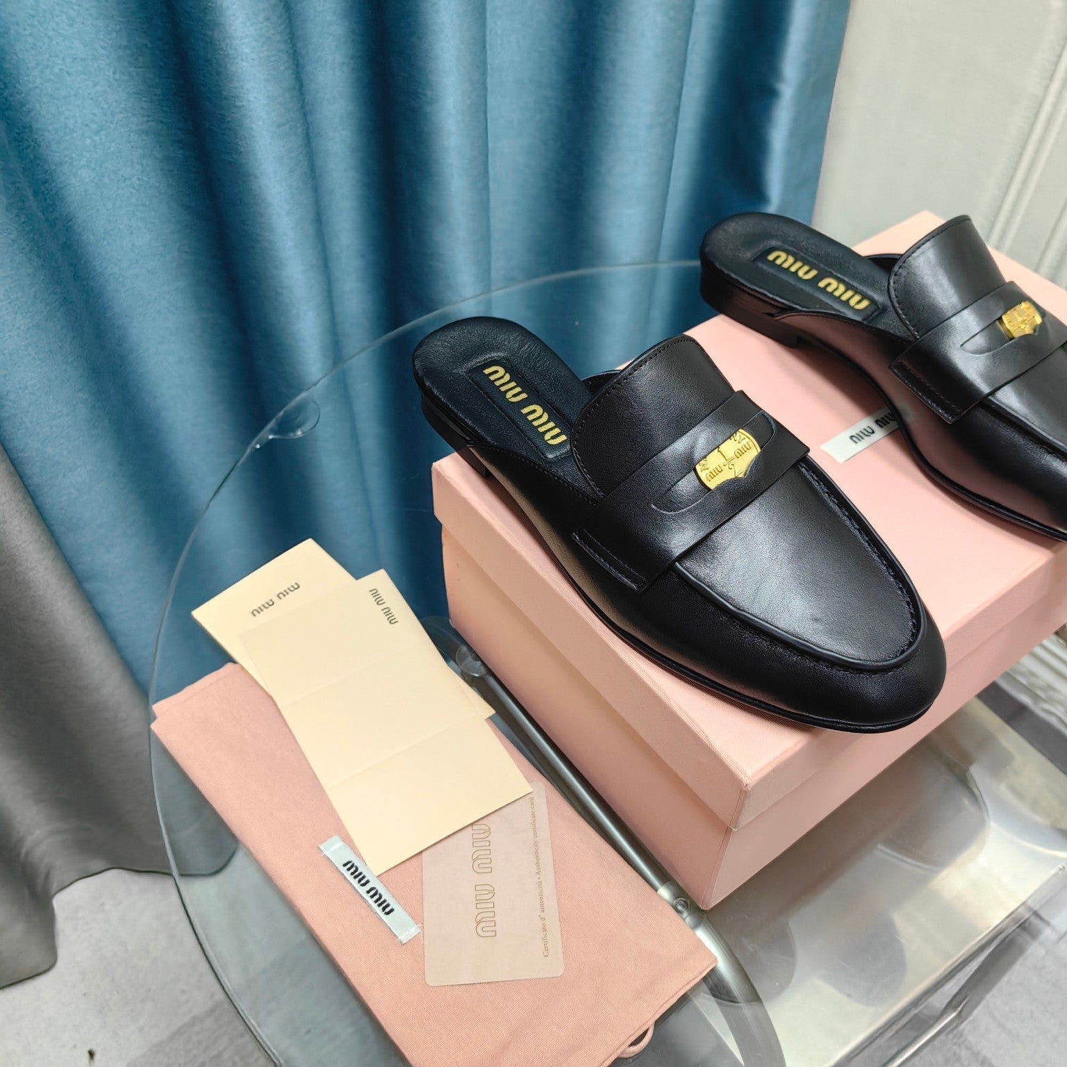 MULES SLIPPERS BLACK COWHIDE WITH GOLD COIN