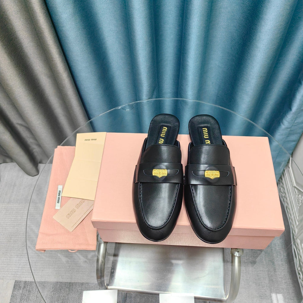 MULES SLIPPERS BLACK COWHIDE WITH GOLD COIN