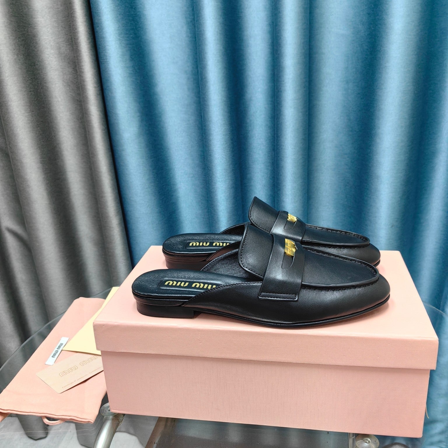 MULES SLIPPERS BLACK COWHIDE WITH GOLD COIN