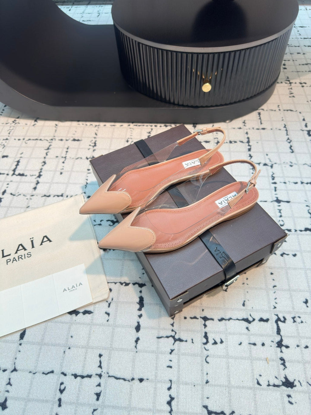 ALAIA FLAT SLINGBACK IN BEIGE BISQUE PATENT CALFSKIN AND FILM