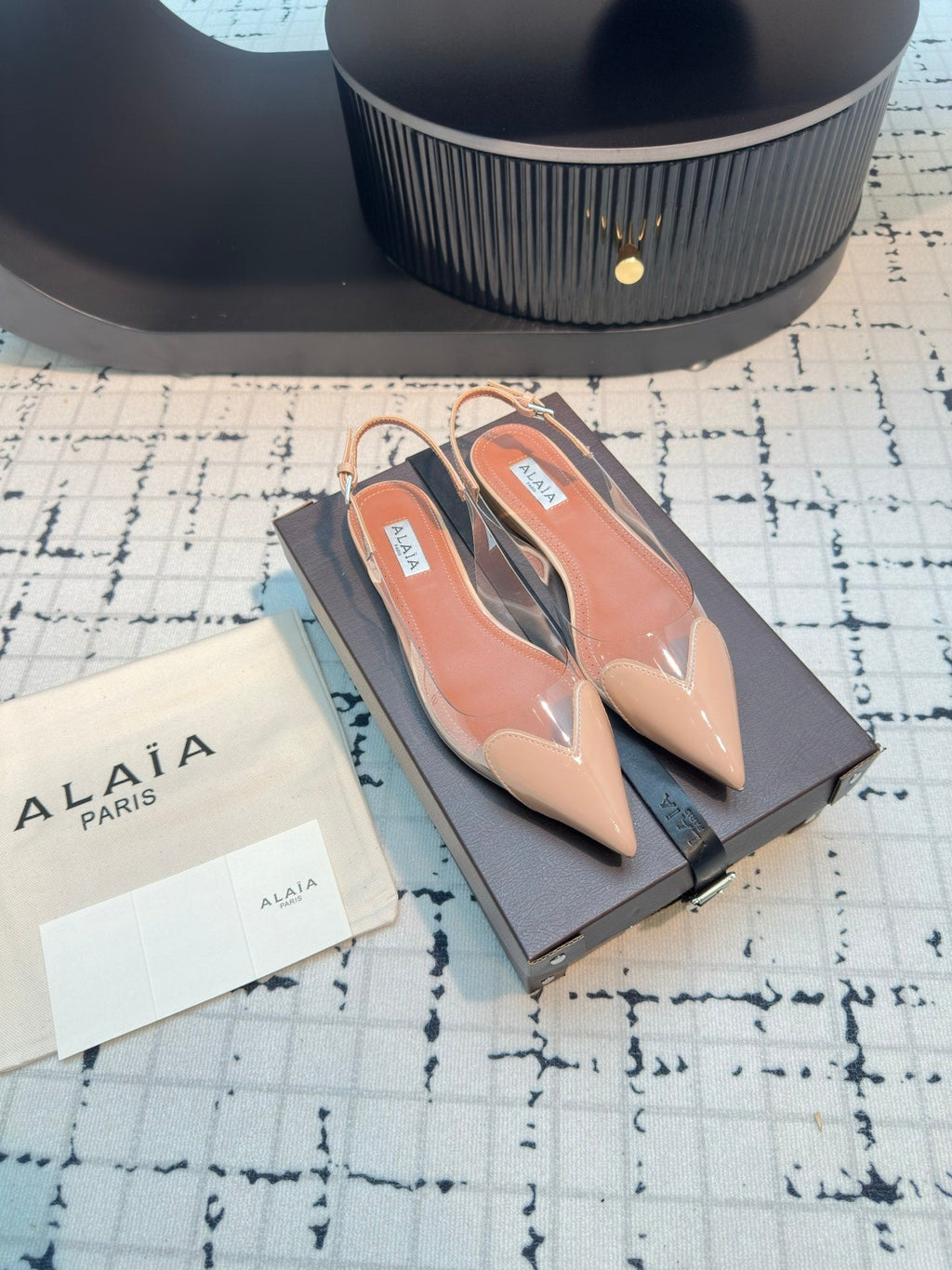 ALAIA FLAT SLINGBACK IN BEIGE BISQUE PATENT CALFSKIN AND FILM
