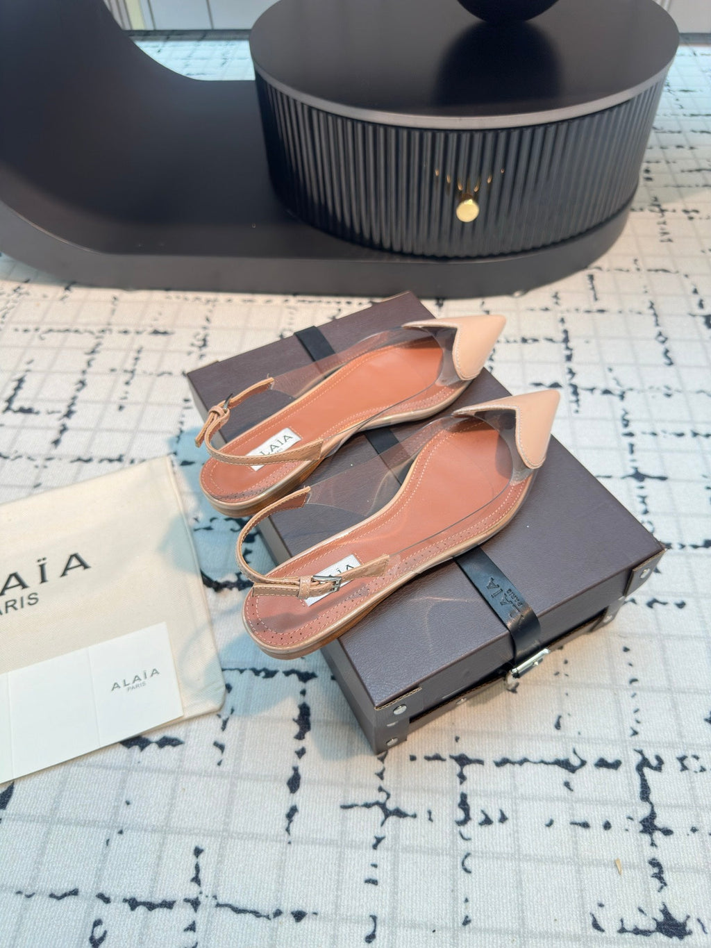 ALAIA FLAT SLINGBACK IN BEIGE BISQUE PATENT CALFSKIN AND FILM