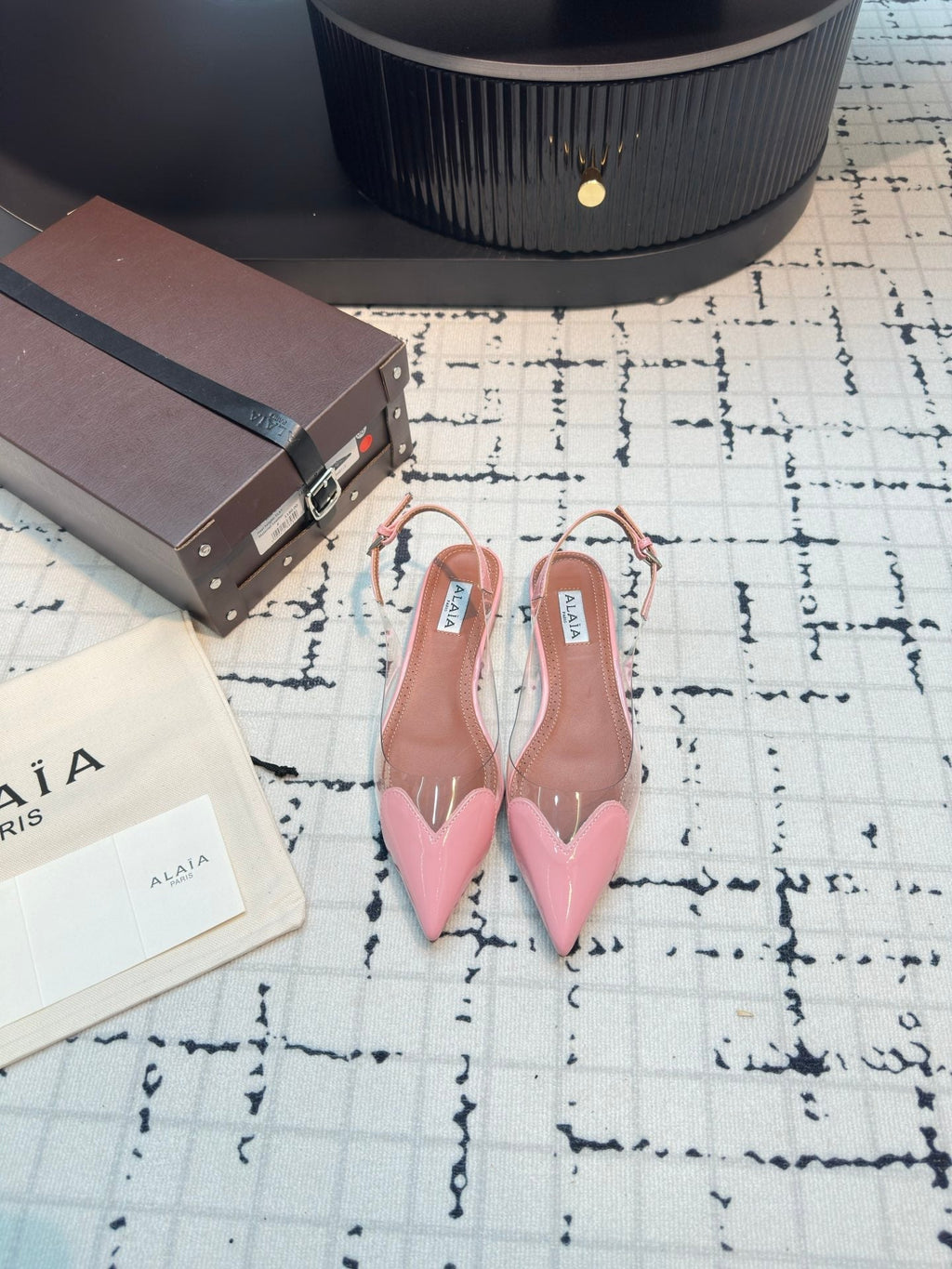 ALAIA FLAT SLINGBACK IN ROSE PINK PATENT CALFSKIN AND FILM