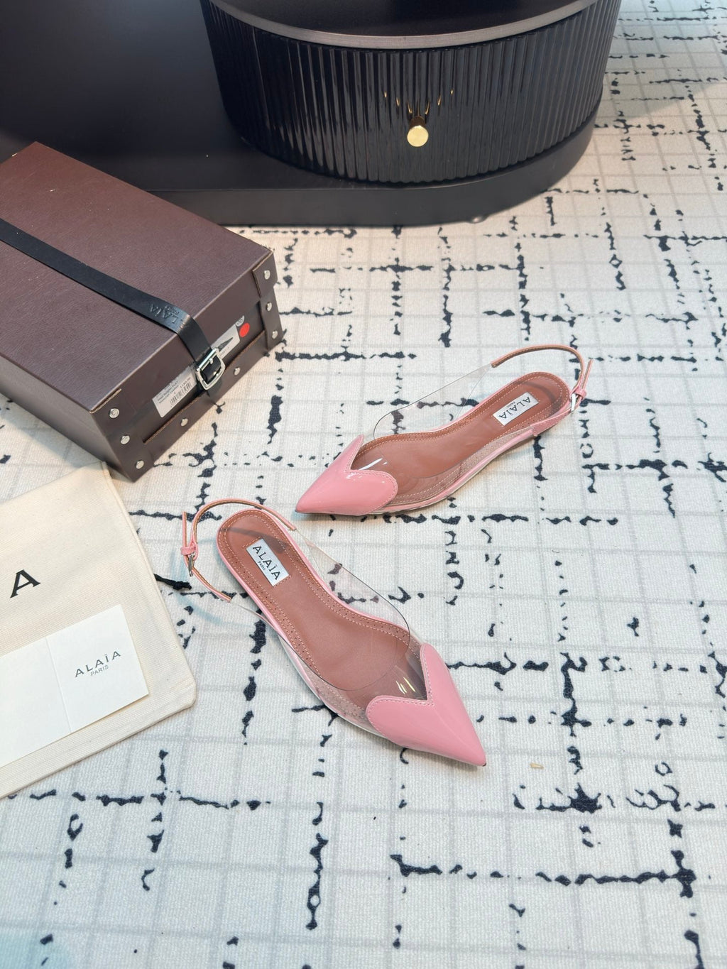 ALAIA FLAT SLINGBACK IN ROSE PINK PATENT CALFSKIN AND FILM