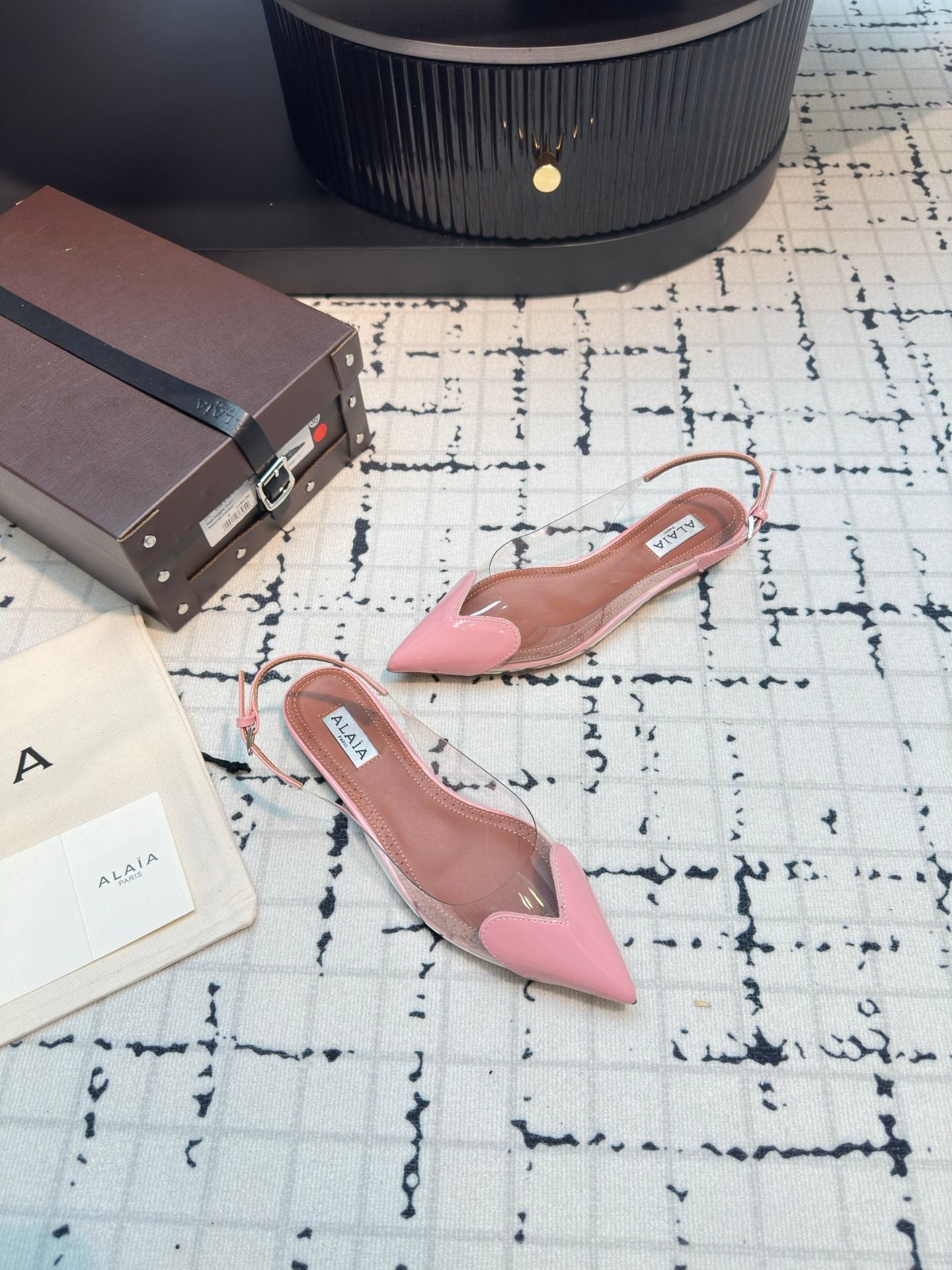 ALAIA FLAT SLINGBACK IN ROSE PINK PATENT CALFSKIN AND FILM