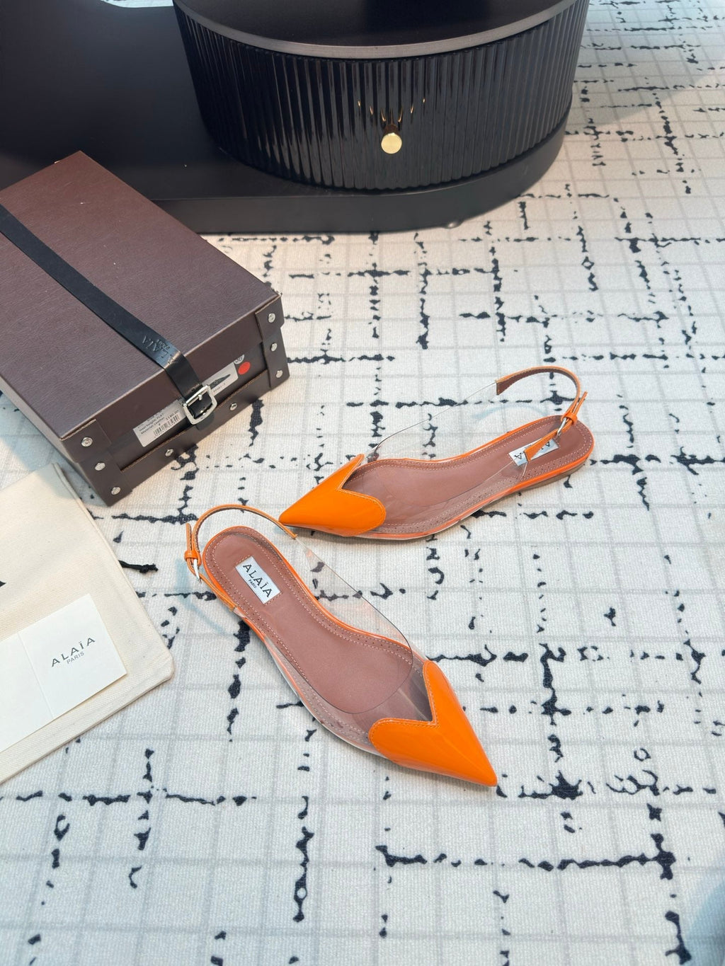 ALAIA FLAT SLINGBACK IN TIGER ORANGE PATENT CALFSKIN AND FILM