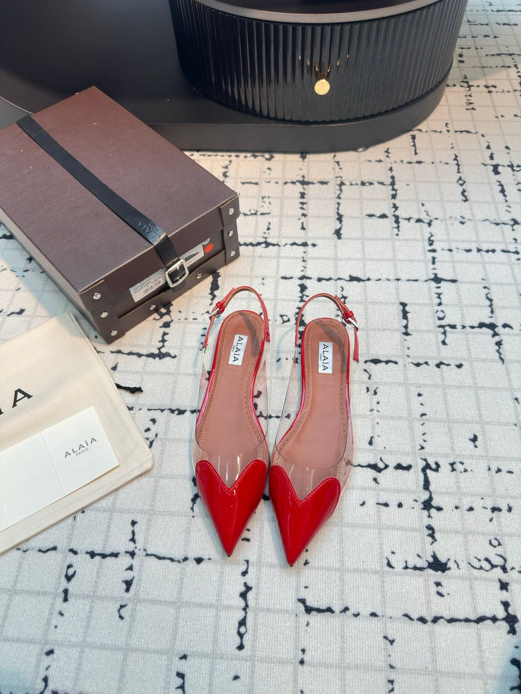 ALAIA FLAT SLINGBACK IN CHERRY RED PATENT CALFSKIN AND FILM