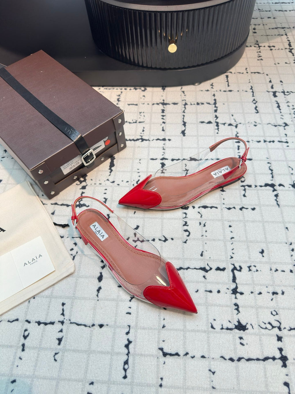 ALAIA FLAT SLINGBACK IN CHERRY RED PATENT CALFSKIN AND FILM