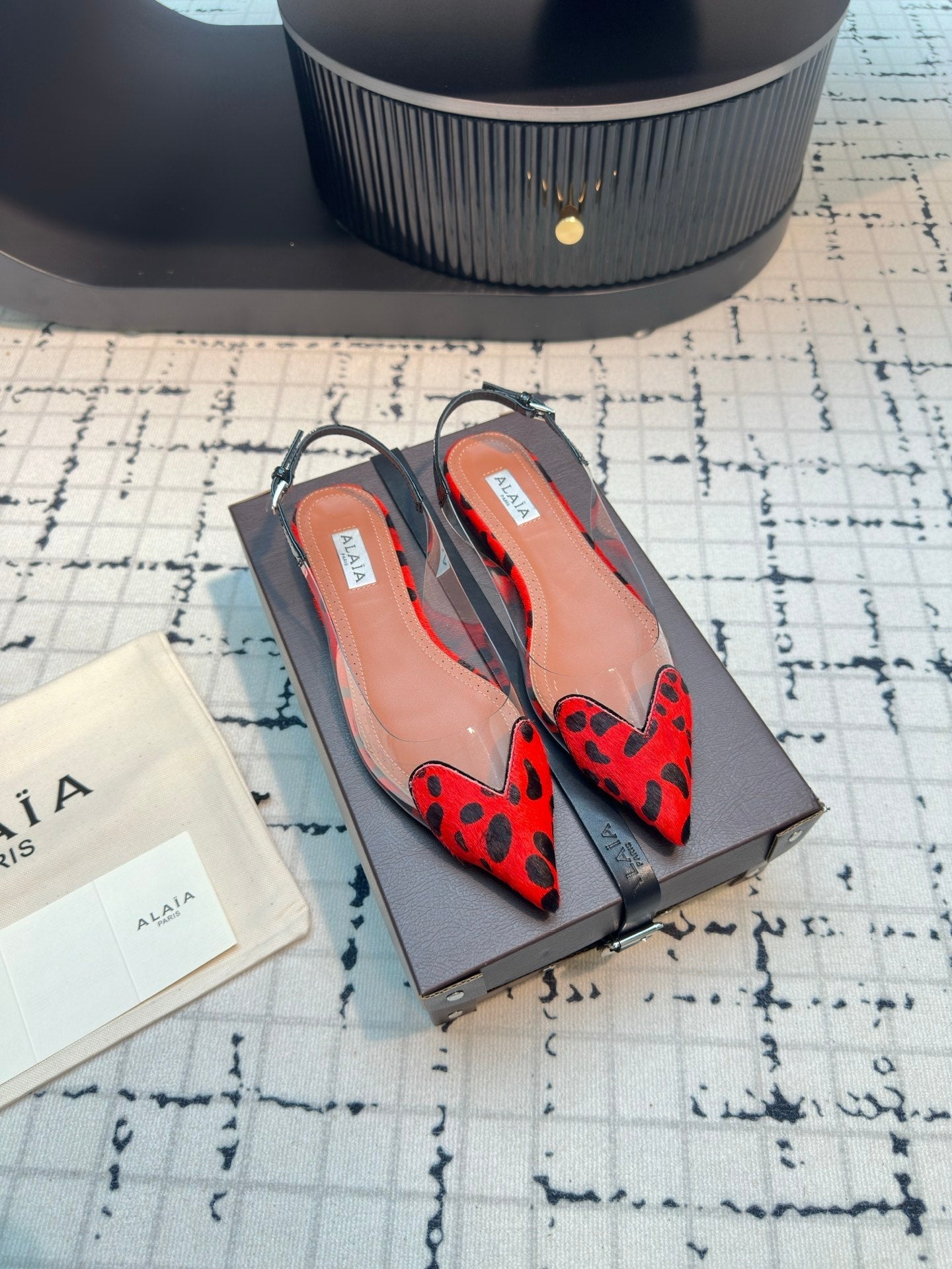 ALAIA FLAT SLINGBACK IN CHERRY RED PATENT CALFSKIN AND FILM