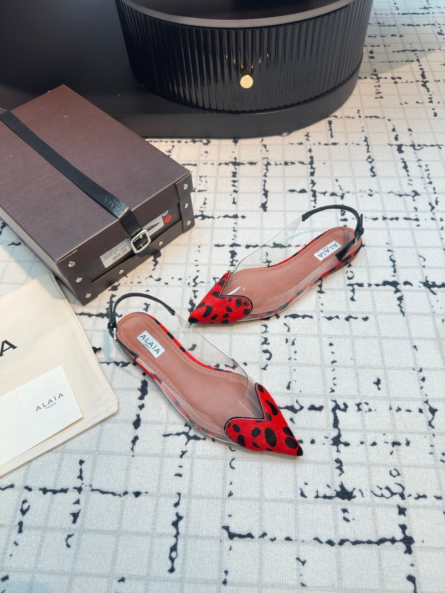 ALAIA FLAT SLINGBACK IN CHERRY RED PATENT CALFSKIN AND FILM