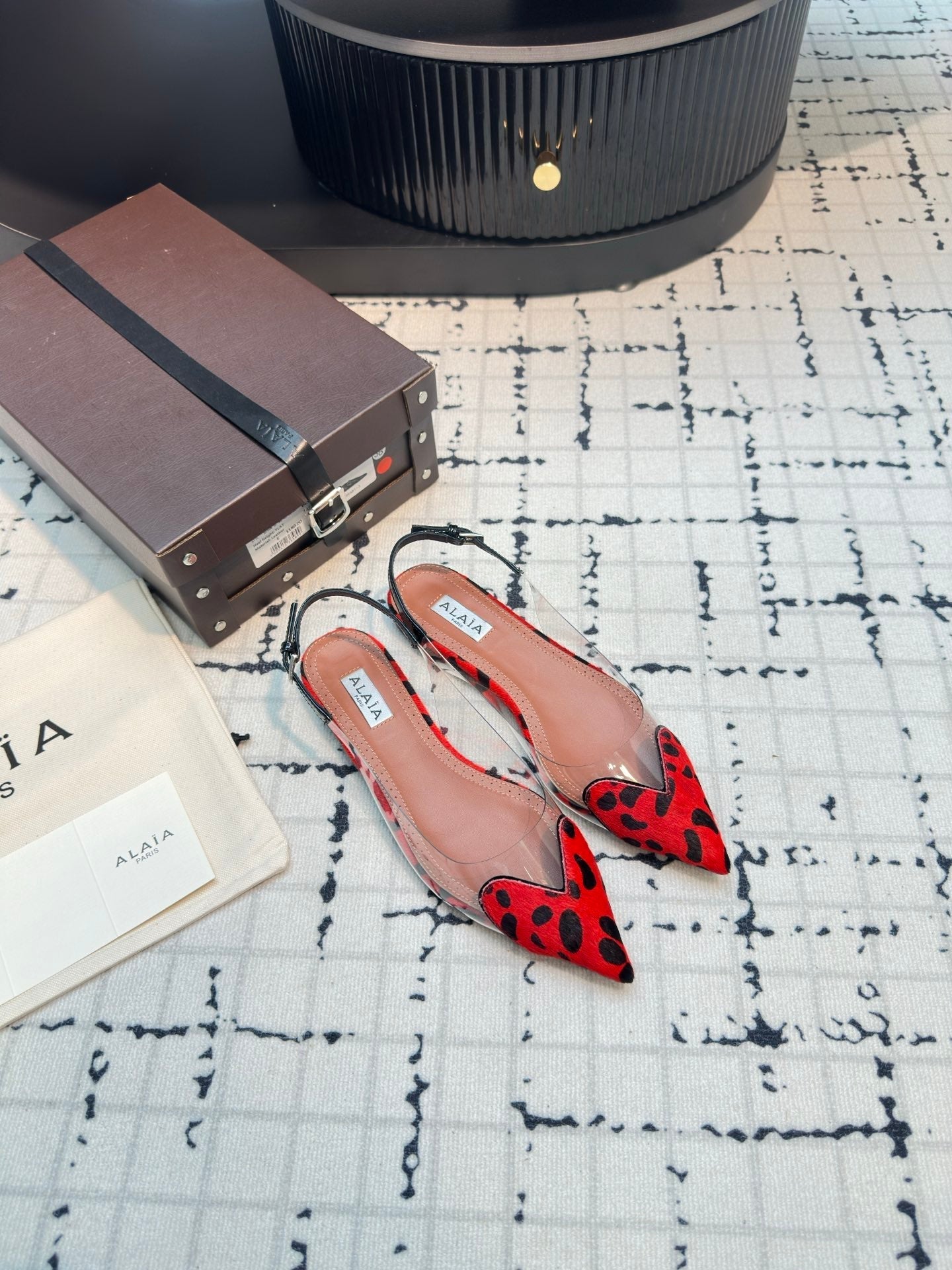 ALAIA FLAT SLINGBACK IN CHERRY RED PATENT CALFSKIN AND FILM