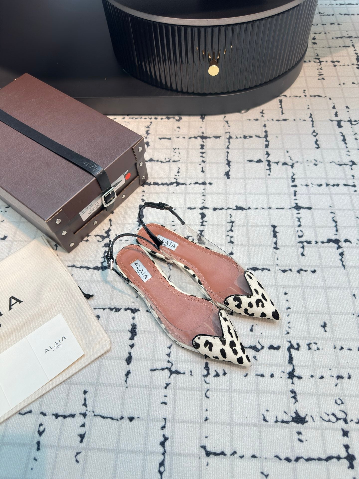 ALAIA FLAT SLINGBACK IN BLACK MIX WHITE PATENT CALFSKIN AND FILM