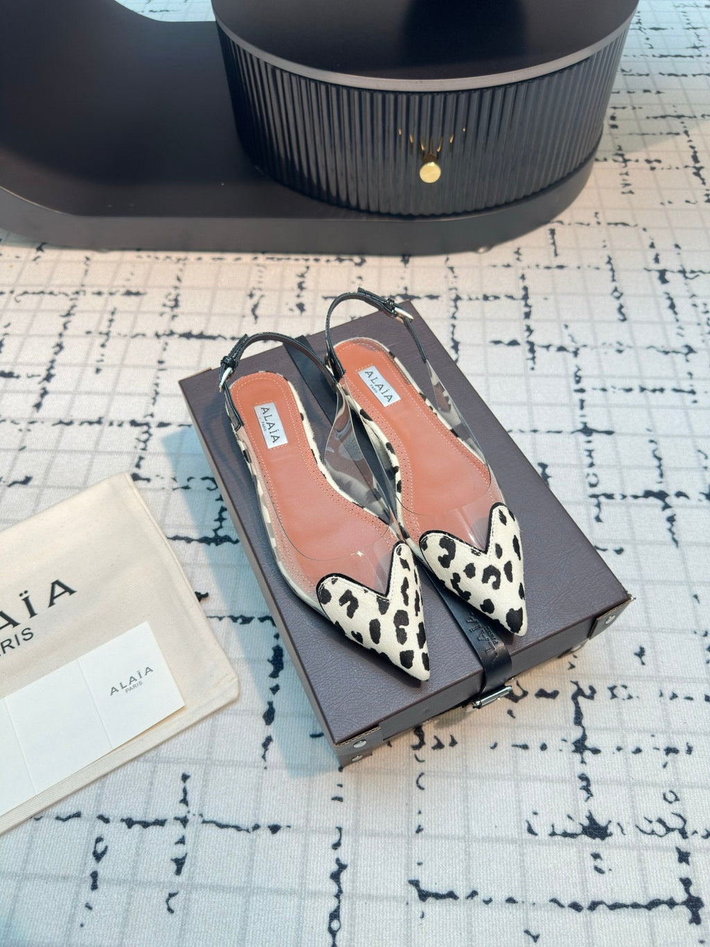 ALAIA FLAT SLINGBACK IN BLACK MIX WHITE PATENT CALFSKIN AND FILM