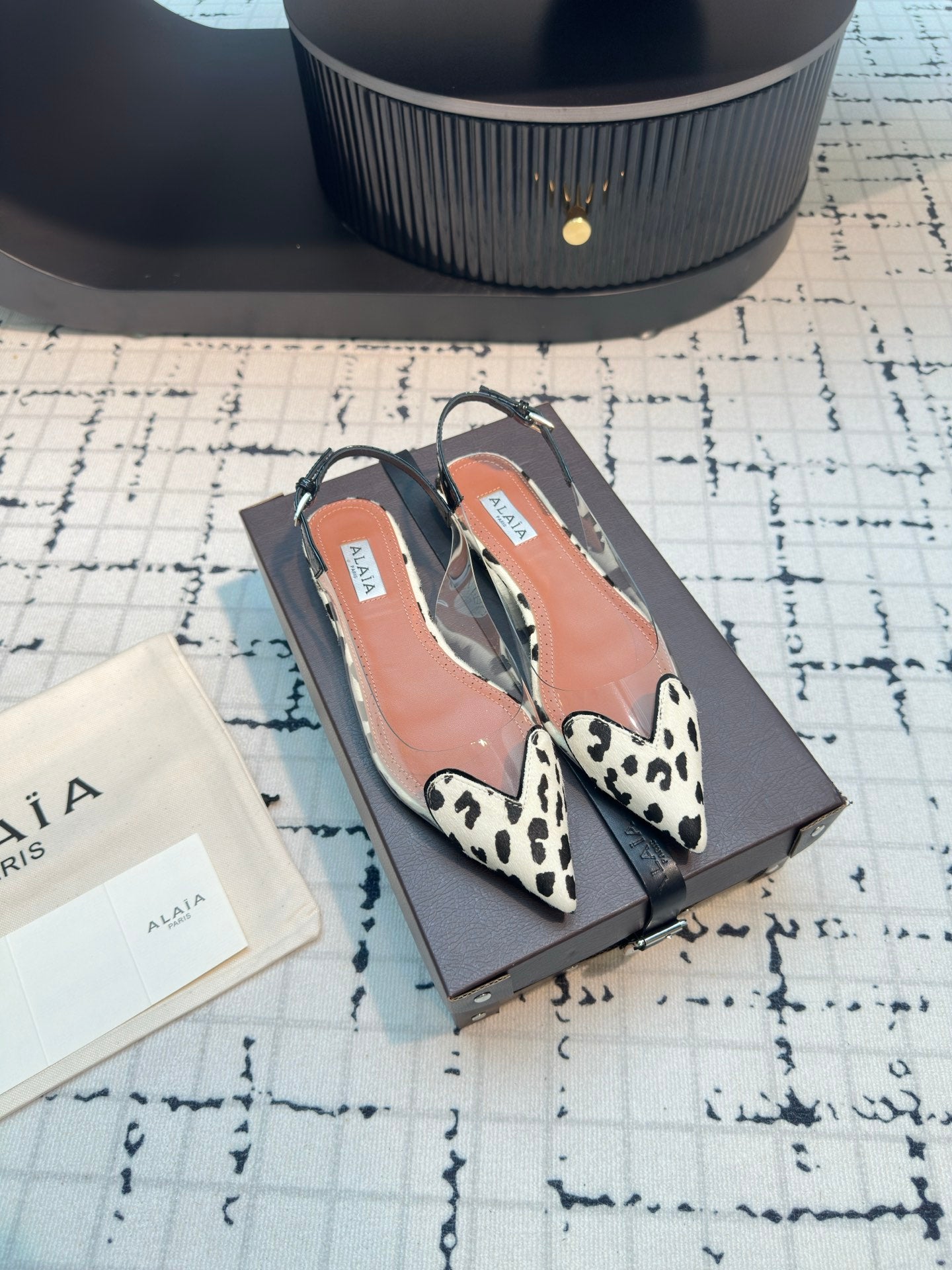 ALAIA FLAT SLINGBACK IN BLACK MIX WHITE PATENT CALFSKIN AND FILM