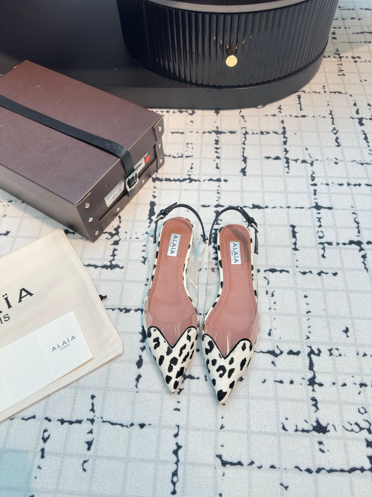 ALAIA FLAT SLINGBACK IN BLACK MIX WHITE PATENT CALFSKIN AND FILM