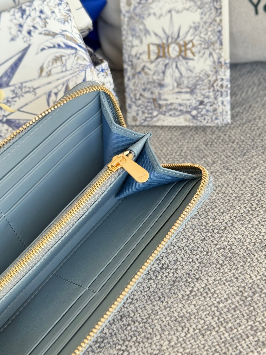 VERTICAL LONG ZIP WALLET 20 IN BABY BLUE QUILTED ALLOVER CALFSKIN