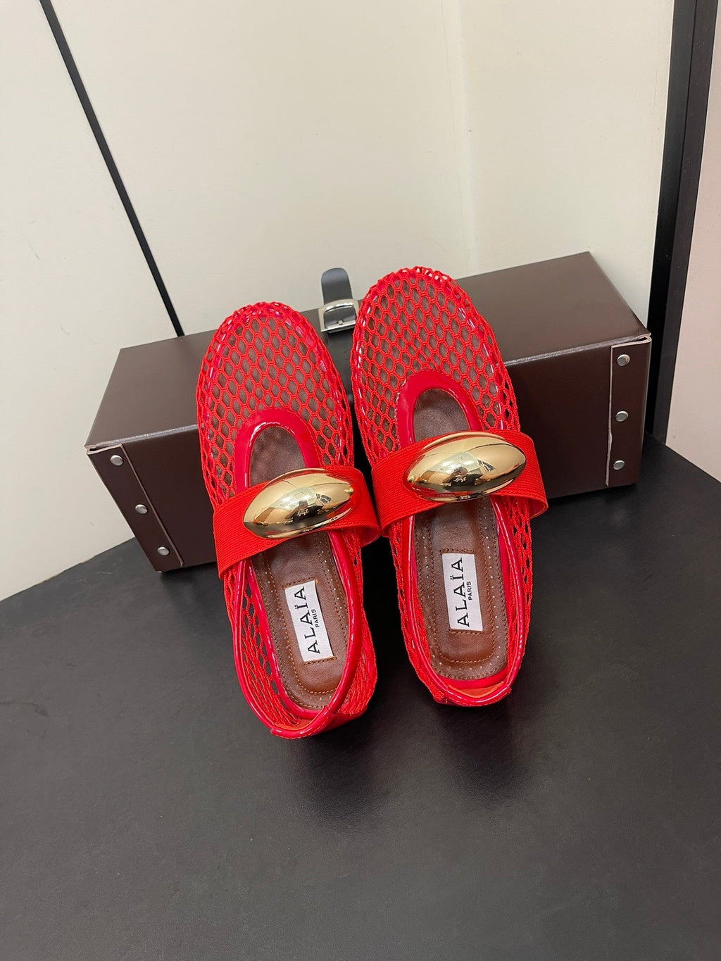 ALAIA BALLET FLATS IN CHERRY RED MESH FISHNET WITH GOLD HARDWARE