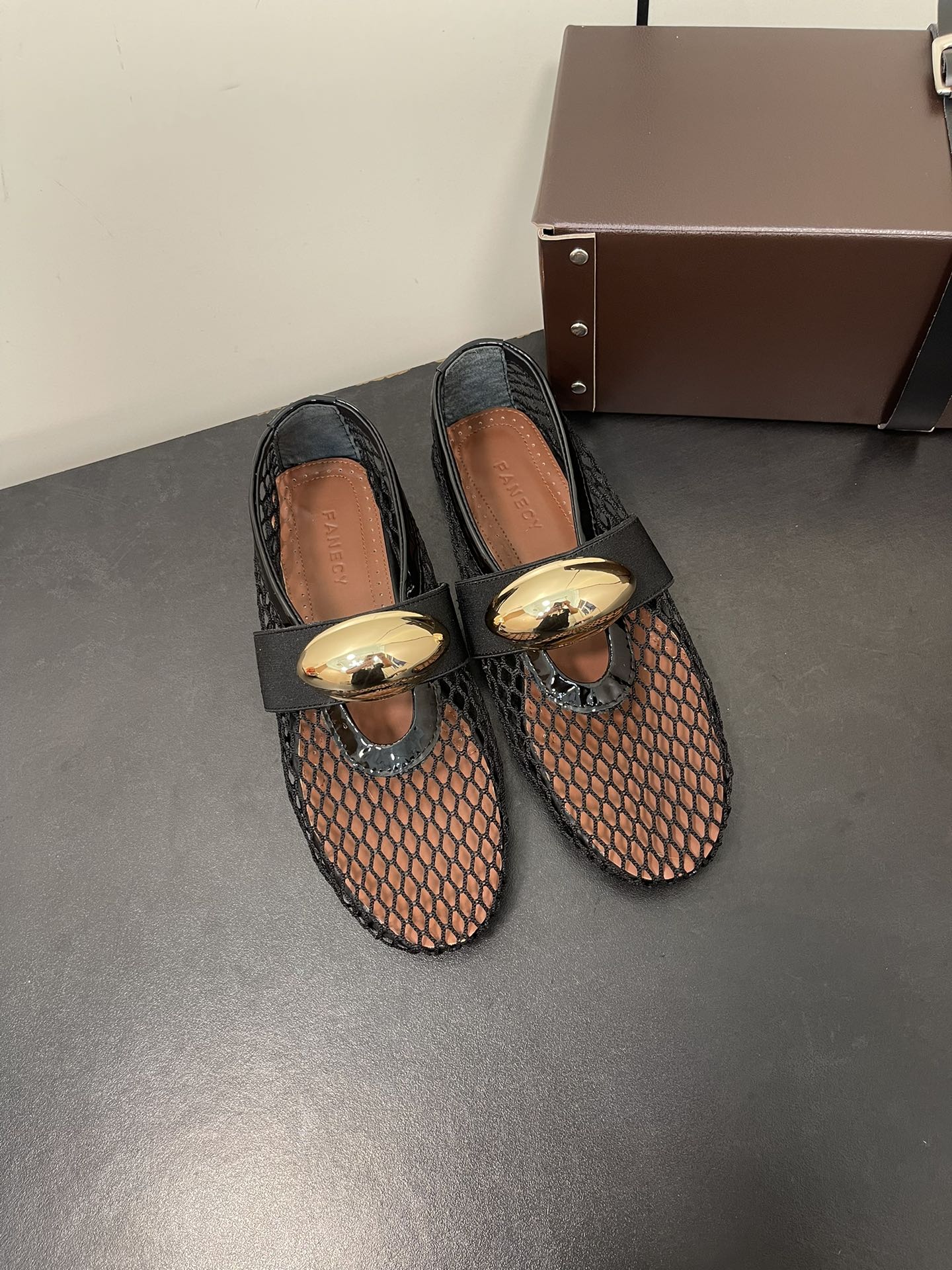 ALAIA BALLET FLATS IN BLACK MESH FISHNET WITH GOLD HARDWARE