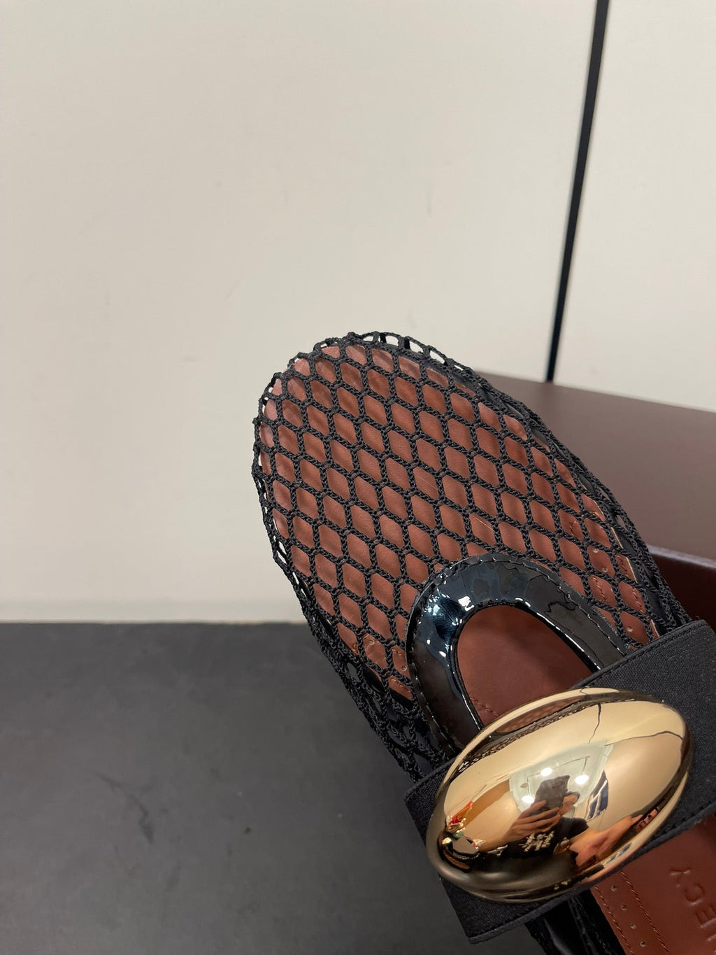 ALAIA BALLET FLATS IN BLACK MESH FISHNET WITH GOLD HARDWARE