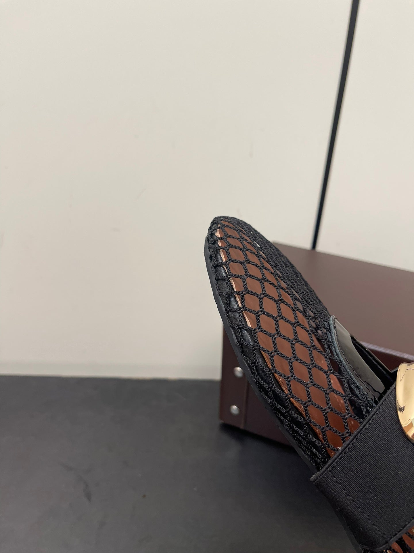 ALAIA BALLET FLATS IN BLACK MESH FISHNET WITH GOLD HARDWARE