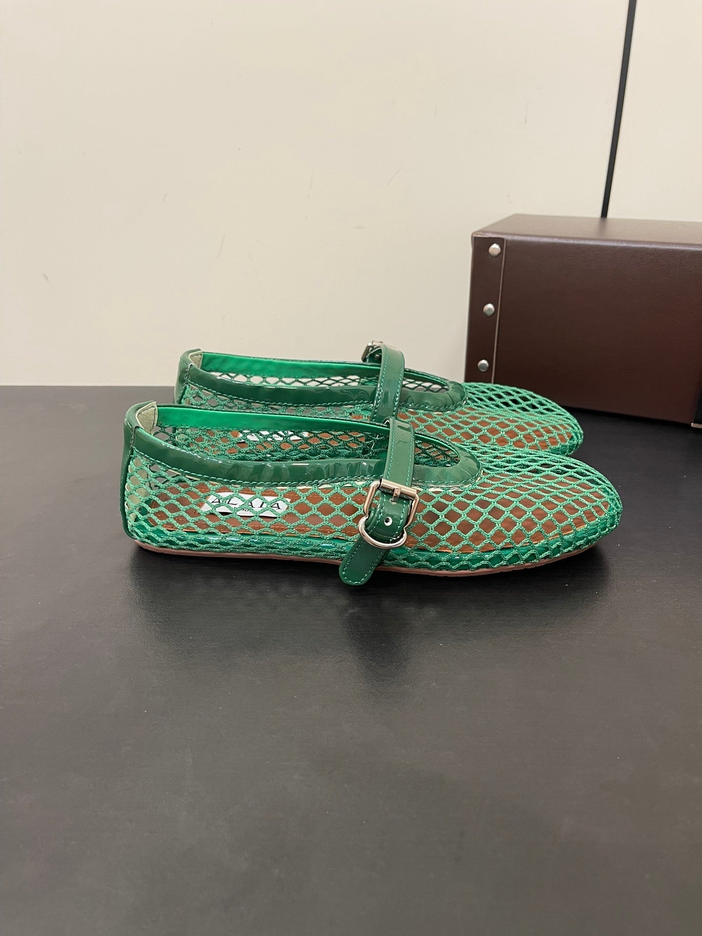 ALAIA BALLET FLATS IN COOL GREEN MESH FISHNET