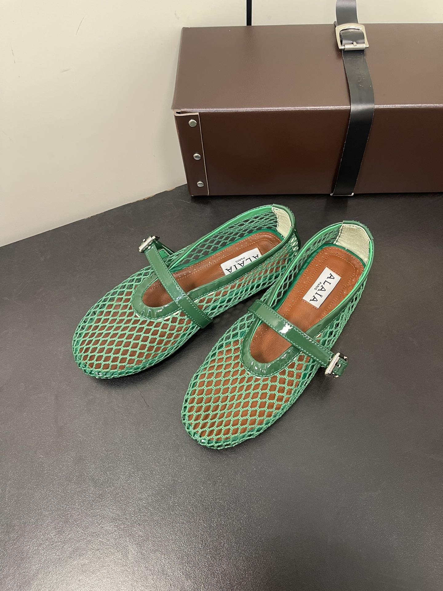 ALAIA BALLET FLATS IN COOL GREEN MESH FISHNET